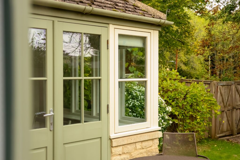 garden,room,exterior,showing,door,and,window,with,reflections,of